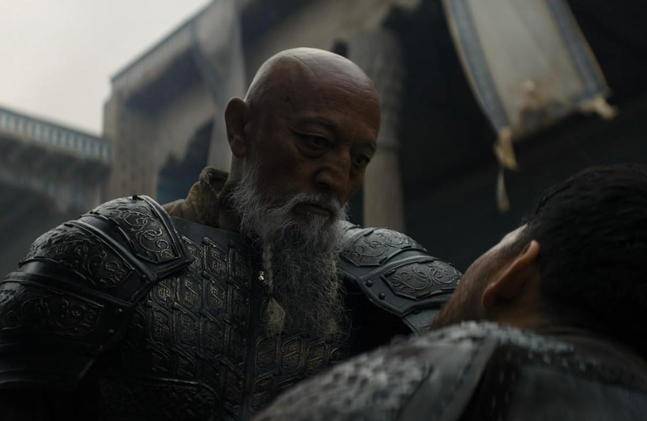 A tense confrontation scene from "Amir Temur: Rise of the Conqueror," as a battle-hardened leader faces a wounded opponent in a fortified setting. (Photo via IMDb)