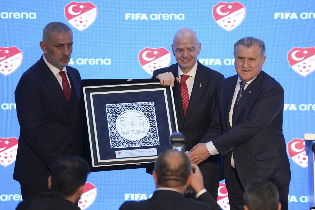 Minister of Youth and Sports Osman Askin Bak (right) and TFF President Ibrahim Haciosmanoglu (left) presented a gift to FIFA President Gianni Infantino (center). Istanbul, Türkiye, April 10, 2026. (AA Photo)