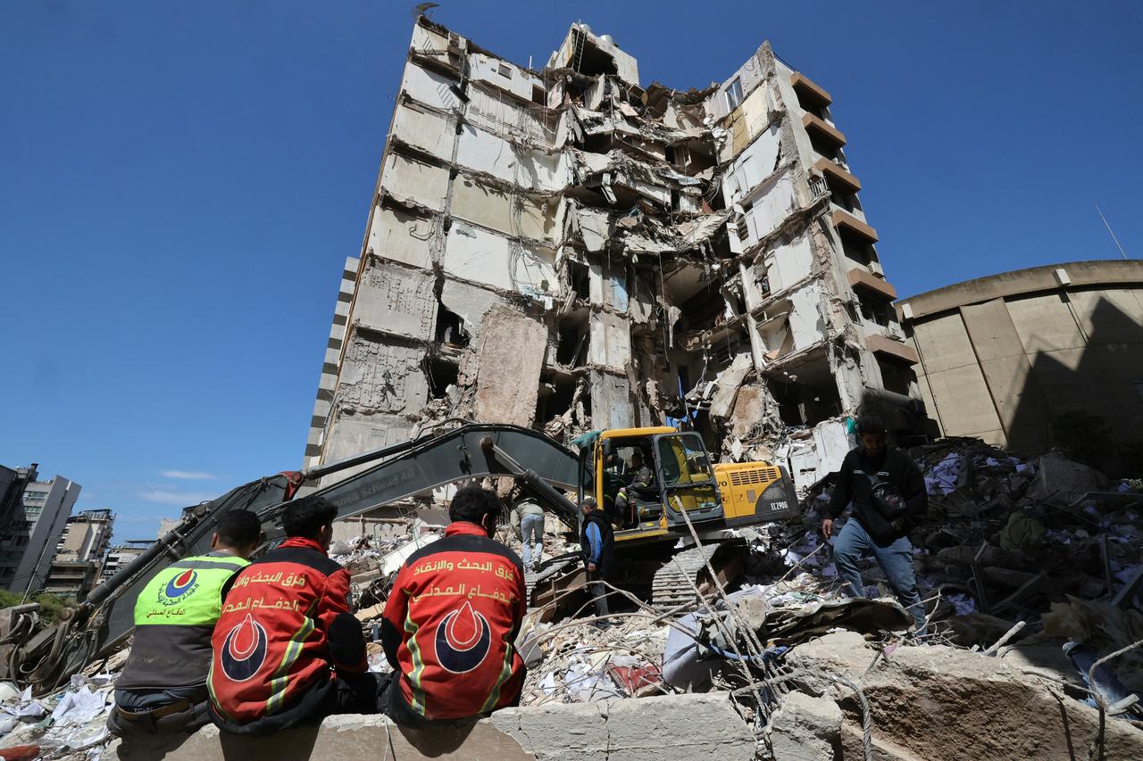 Lebanese rescuers clear the rubble at the site of an Israeli airstrike that targeted a building the day before in the Lebanese capital of Beirut on April 9, 2026. (AFP Photo)