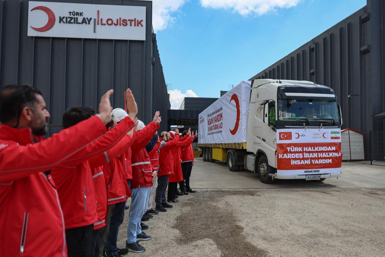 Workers wave as trucks of Turkish Red Crescent leaves to send supplies to Iran, in Ankara, Türkiye on April 10, 2026. (AFP Photo)