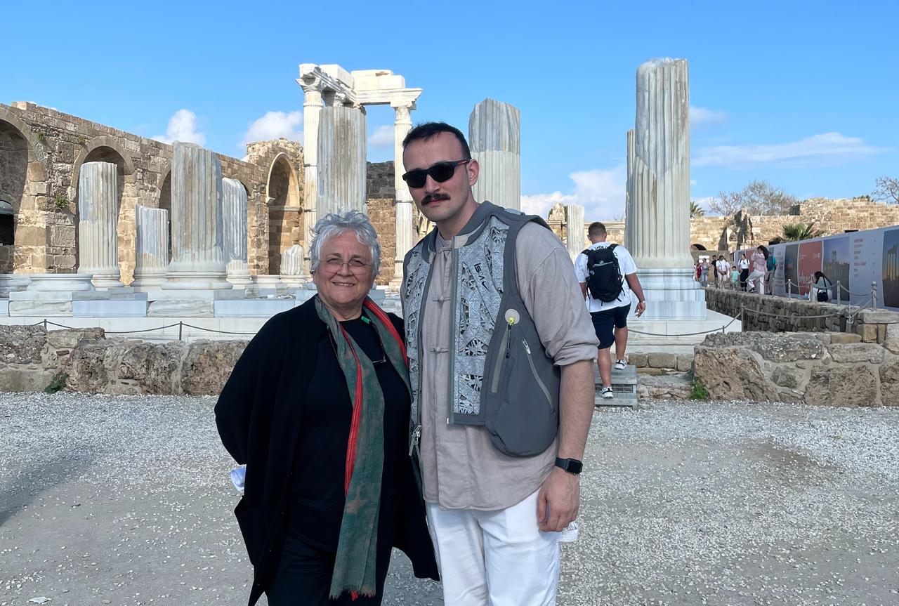 Professor Feristah Alanyali and Koray Erdogan pose after interview in the ancient city of Side, Antalya, Türkiye, April 8, 2026. (Photo by Türkiye Today team)