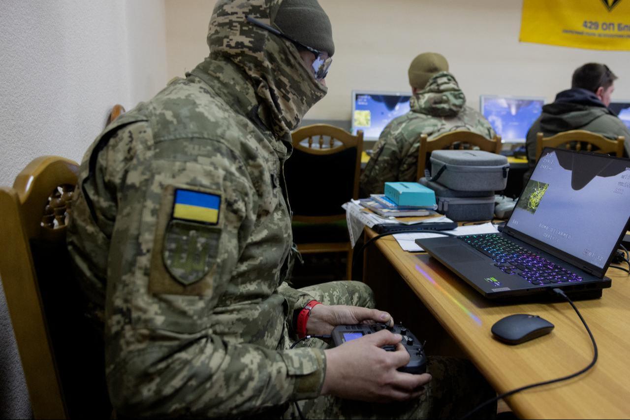 Members of the private air defense training group take part in simulator exercises in the training center's classroom at an undisclosed location, on April 8, 2026. (AFP Photo)