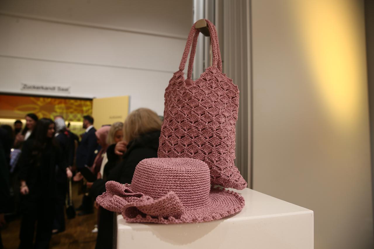 Handmade bag and hat produced with paper yarn are displayed at the Gobeklitepe-themed exhibition in Vienna, Austria. (AA Photo)