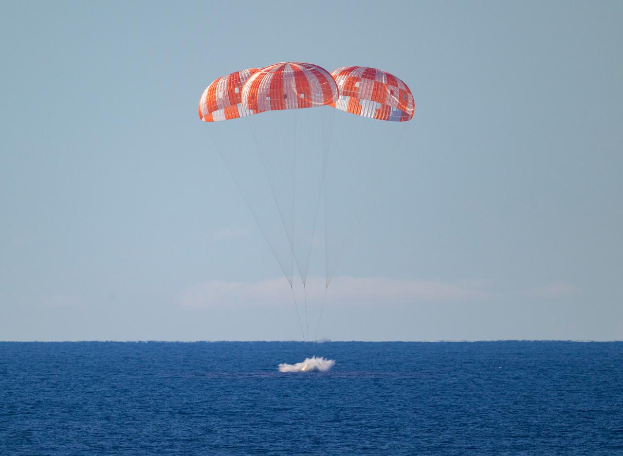 This handout photo released by NASA shows NASA’s Orion spacecraft with Artemis II crewmembers landing in the Pacific Ocean off the coast of California, on April 10, 2026.