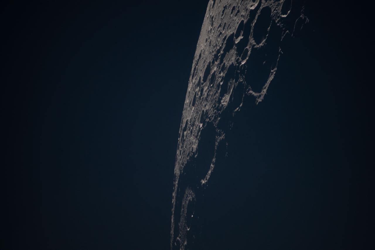 This handout picture released on April 10, 2026 by NASA shows A close-up view of the Birkhoff crater on the Moon’s far side, captured by the Artemis II crew, from the Orion spacecraft revealing the surface under low-light conditions.