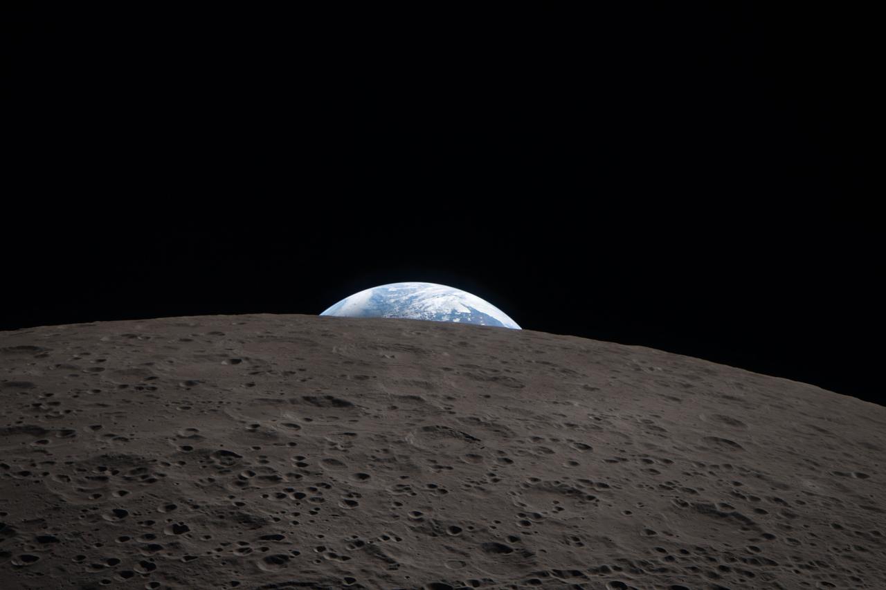This handout picture released by NASA on April 10, 2026 and taken on April 6, 2026 shows an image of Earthset captured by the Artemis II crew as they pass behind the Moon’s far side.