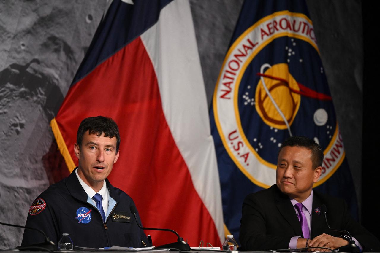 NASA Orion program manager Howard Hu (R) listen to NASA flight director Rick Henfling (L) speak during a press conference at Johnson Space Center in Houston, Texas, on April 10, 2026, after the Artemis II astronauts splashed down in the Pacific Ocean off the coast of California.