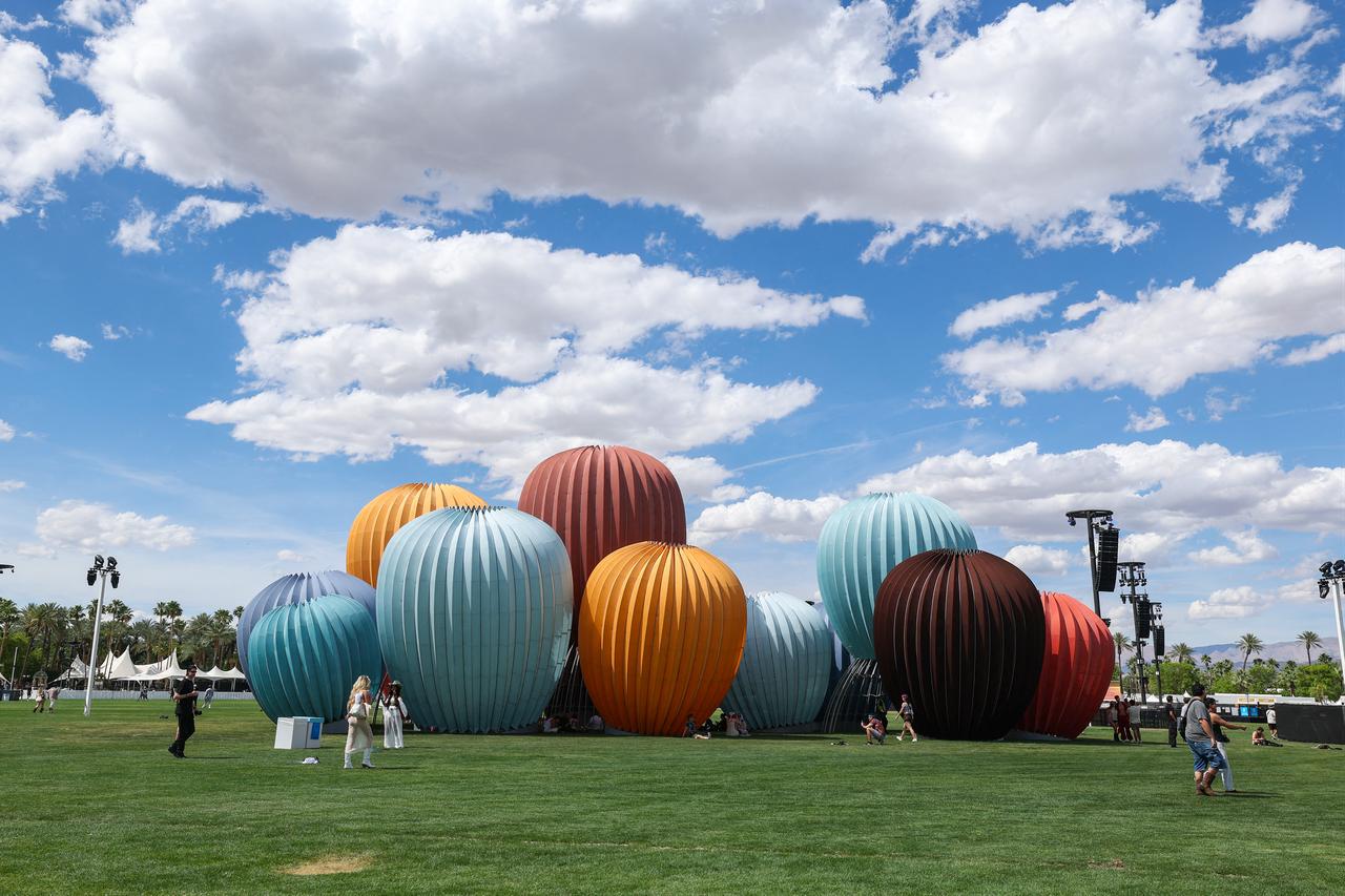 Festival-goers stand near the “Starry Eyes” installation designed by architect Kyriakos Chatziparaskevas during the 2026 Coachella Valley Music and Arts Festival in Indio, California, April 10, 2026. (AFP Photo)