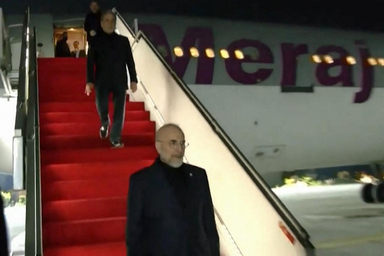 The Iranian delegation led by Parliament Speaker Mohammad Bagher Ghalibaf (C) and Foreign Minister Abbas Araghchi (L) arriving at Nur Khan air base in Rawalpindi, near Islamabad, April 11, 2026. (Photo by Handout/Pakistan's Ministry of Foreign Affairs/AFP)