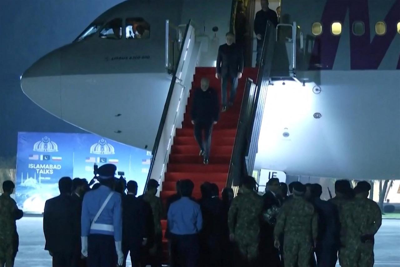 The Iranian delegation walking down the stairs of their plane after arriving at Nur Khan air base in Rawalpindi, near Islamabad, April 11, 2026. (Photo by Handout/Pakistan's Ministry of Foreign Affairs/AFP)