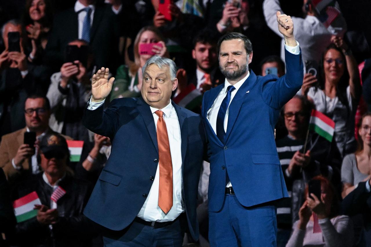 US Vice President JD Vance (R) and Hungarian Prime Minister Viktor Orban wave on stage during a "Day of Friendship" event at MTK Sportpark in Budapest, Hungary on April 7, 2026. (AFP Photo)
