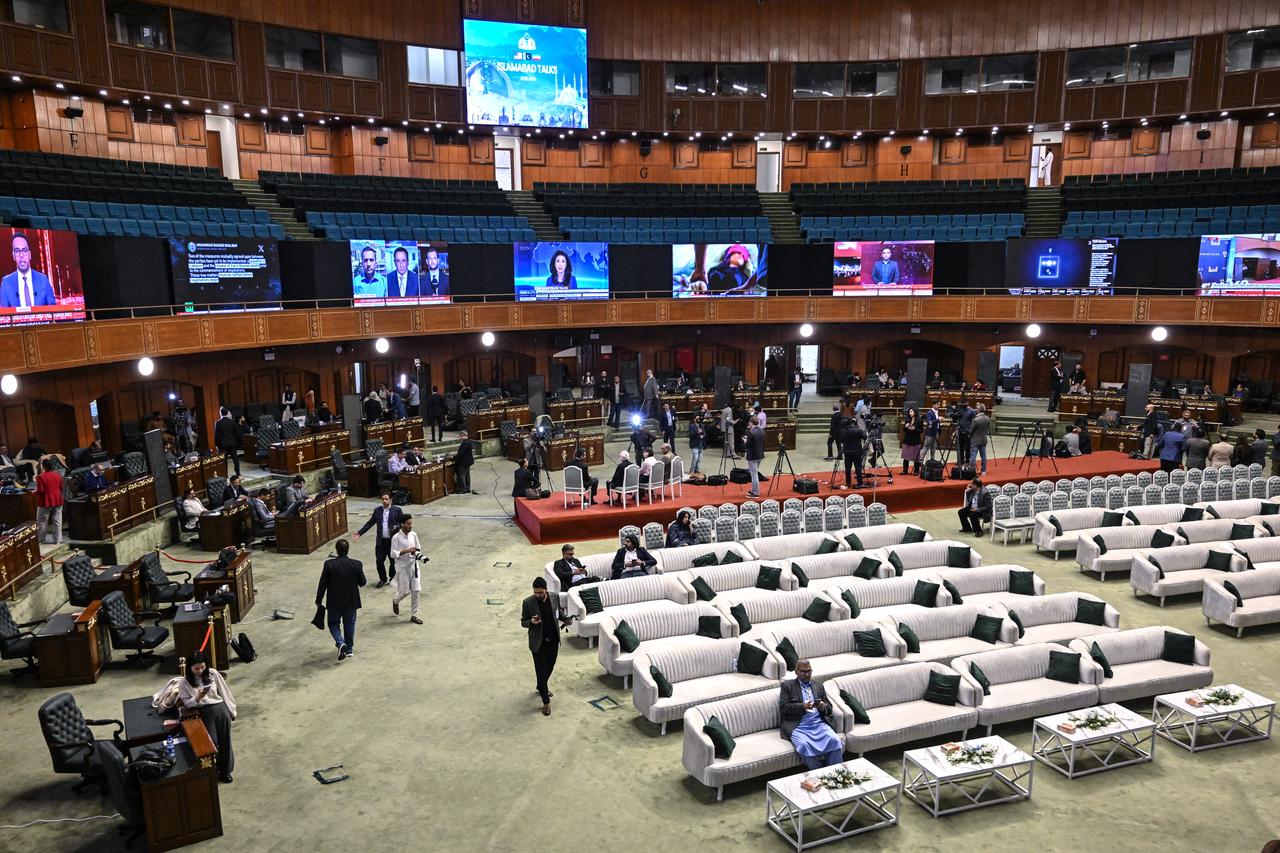 Journalists work at a media facilitation center ahead of US–Iran peace talks in Islamabad on April 11, 2026. (AFP Photo)