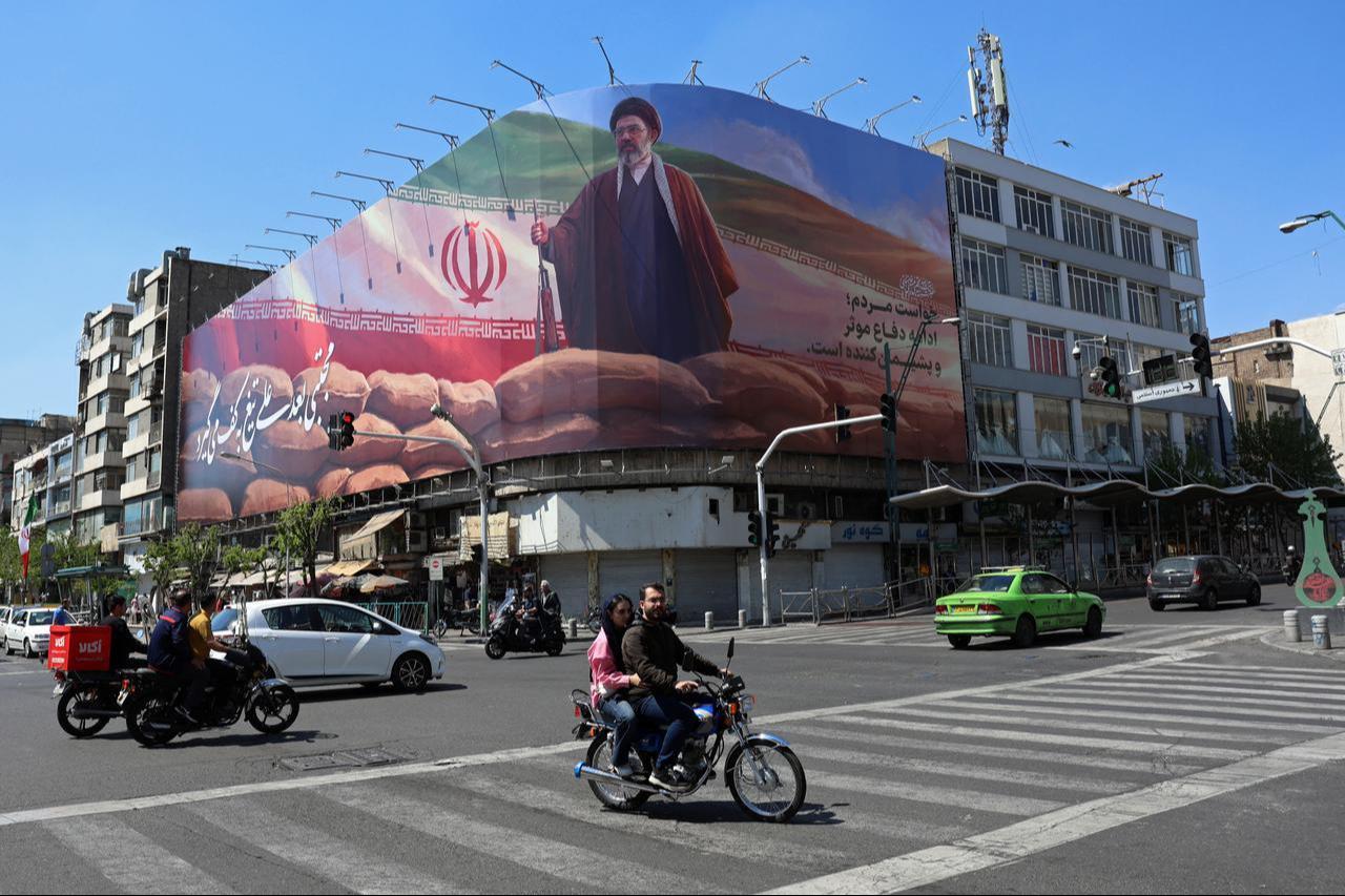Motorists drive past a giant billboard of Iranian supreme leader Mojtaba Khamenei, along a street in Tehran, Iran on April 10, 2026. (AFP Photo)