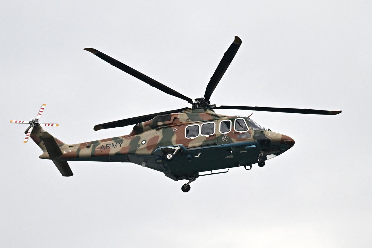 A Pakistani army helicopter flies over the Red Zone area ahead of US-Iran peace talks in Islamabad on April 11, 2026. (AFP Photo)