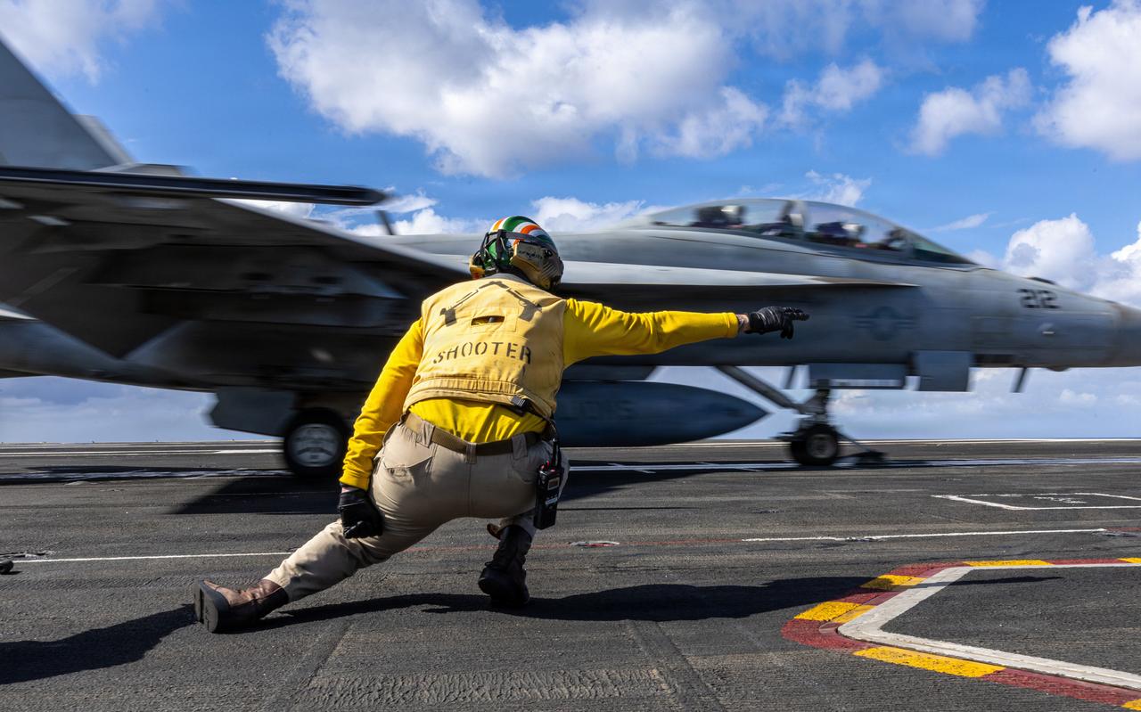 A U.S. Sailor signals the launch of an F/A-18F Super Hornet aircraft on the flight deck of USS Gerald R. Ford (CVN 78) in the Eastern Mediterranean Sea, March 22, 2026. (Photo via U.S. Navy)