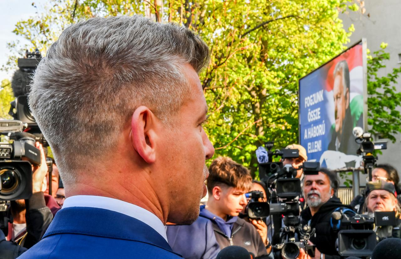 Peter Magyar (L), leader of the pro-European conservative TISZA party, talks with journalists after casting his ballot at a polling station in Budapest during a general election in Hungary, on April 12, 2026. (AFP Photo)