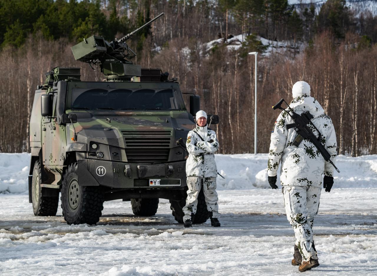 A member of Germany's Mountain Supply Company 23 stands in front of an Eagle 5 armored vehicle during a demonstration near Setermoen on March 12, 2026. (AFP Photo)