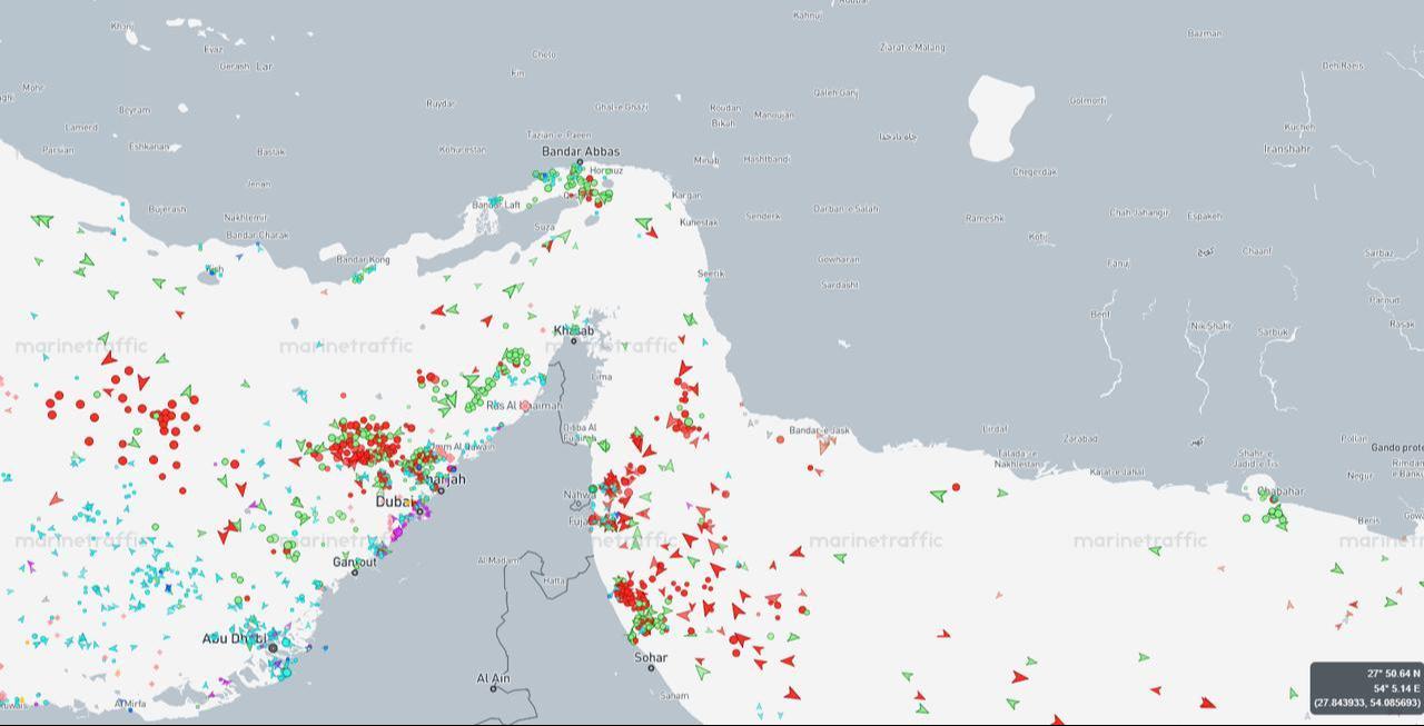 Map shows dense clusters of commercial and tanker vessels around the Strait of Hormuz and Gulf ports, April 13, 2026. (Image via MarineTraffic)