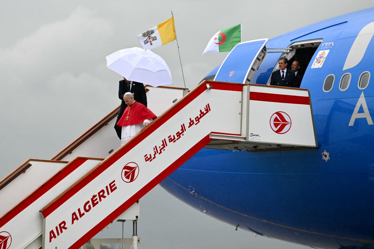 Pope Leo XIV disembarks from the plane after landing at the Houari Boumediene International Airport, Algeria on April 13, 2026. (AFP Photo)