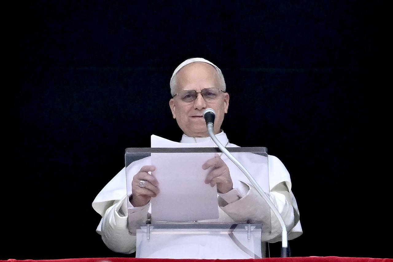Pope Leo XIV addresses the crowd from the window of the apostolic palace overlooking St. Peter's square during the Regina Caeli prayer in The Vatican, April 12, 2026. (AFP Photo)