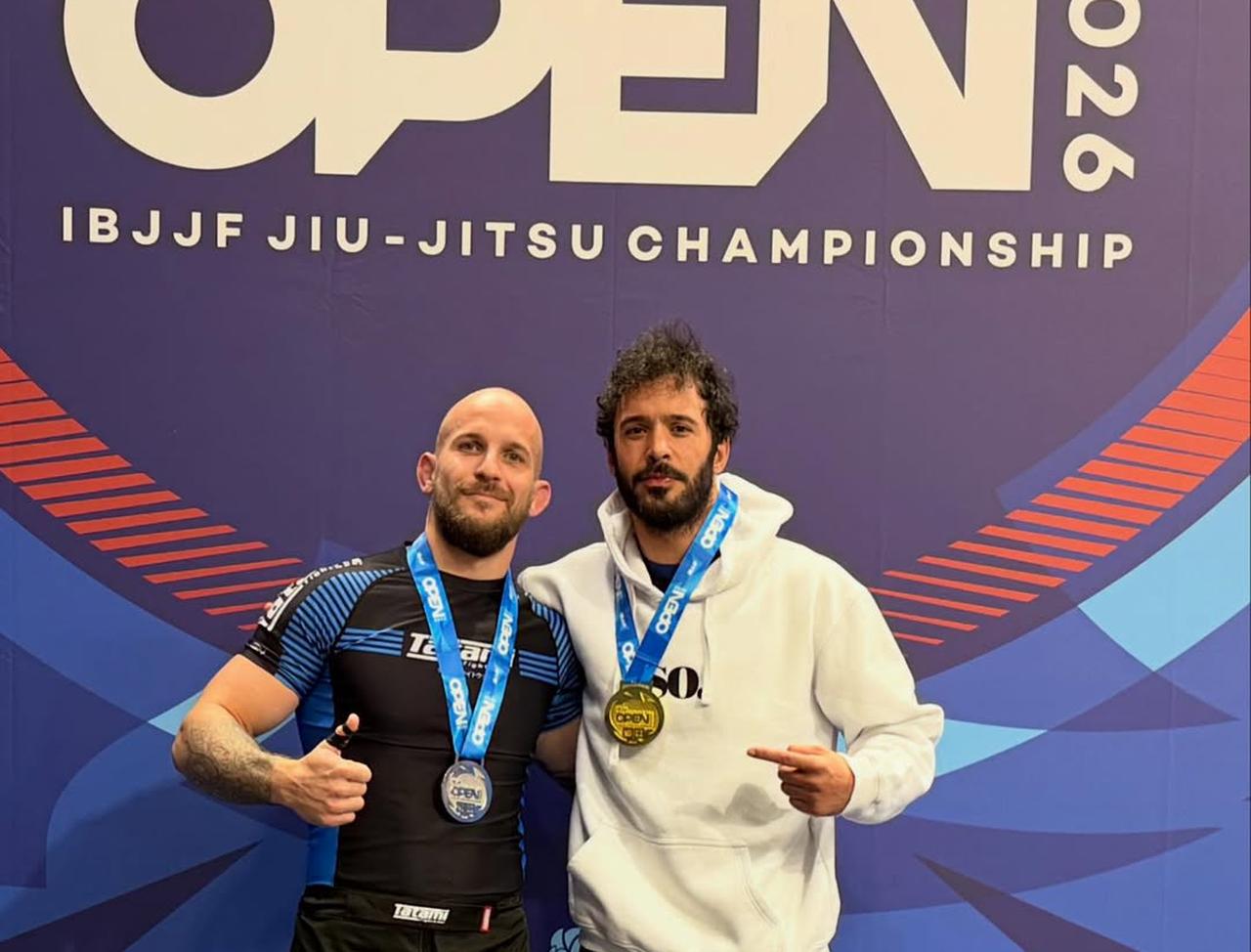 Baris Arduc (R) poses with a fellow competitor after winning gold at the Milan International Open-IBJJF Jiu-Jitsu Championship in Milan, Italy, April 2026. (Photo via Instagram/@arducbrs)