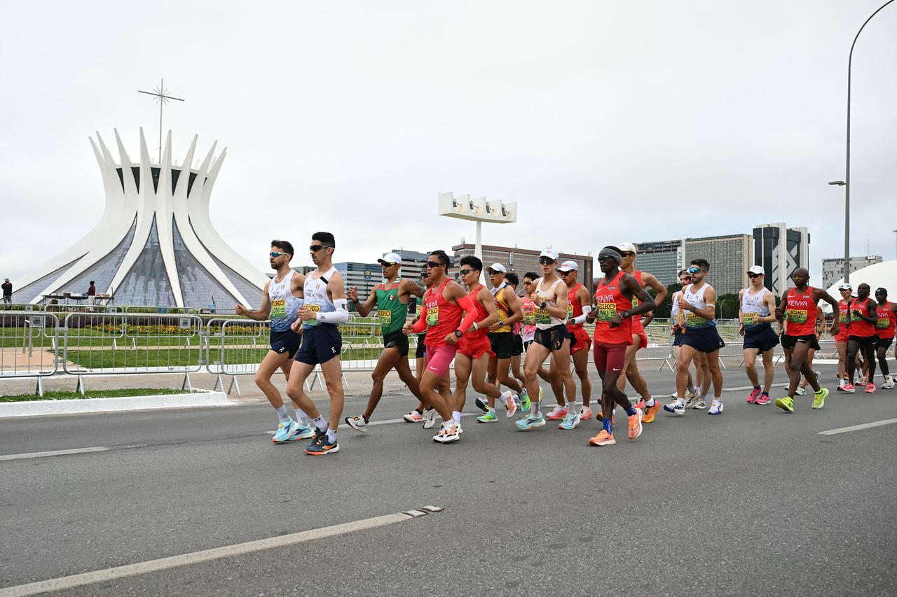 Competitors march past the Metropolitan Cathedral of Our Lady of Aparecida during the World Athletics Race Walking Team Championships marathon walk race, in Brasilia, April 12, 2026. (AFP Photo)