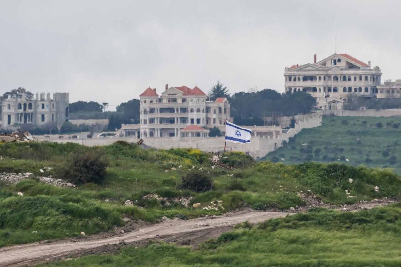 An Israeli flag flutters in southern Lebanon near the border, as seen from the Upper Galilee in northern Israel, on April 12, 2026. (AFP Photo)