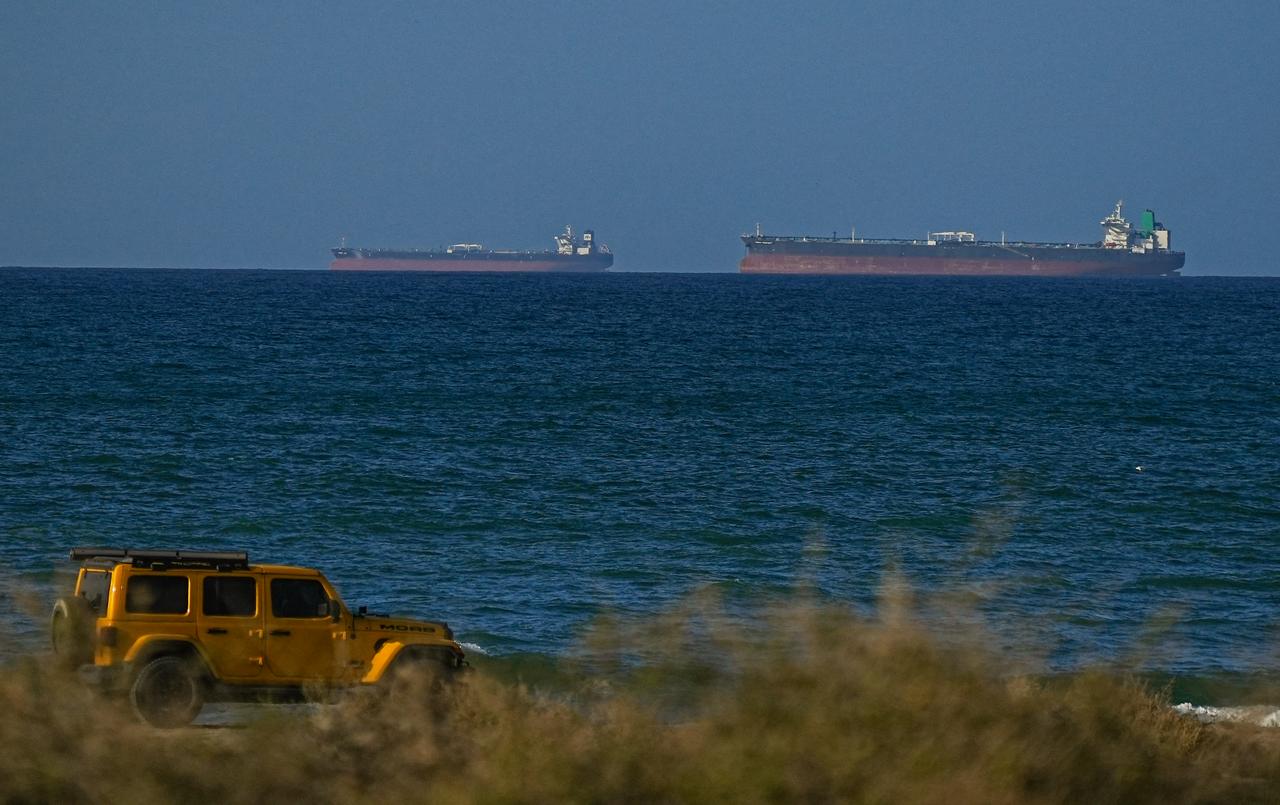 A view of the vessels passing through Strait of Hormuz following the two-week temporary ceasefire reached between the United States and Iran on the condition that the strait be reopened, seen in Oman on April 08, 2026. (AA Photo)