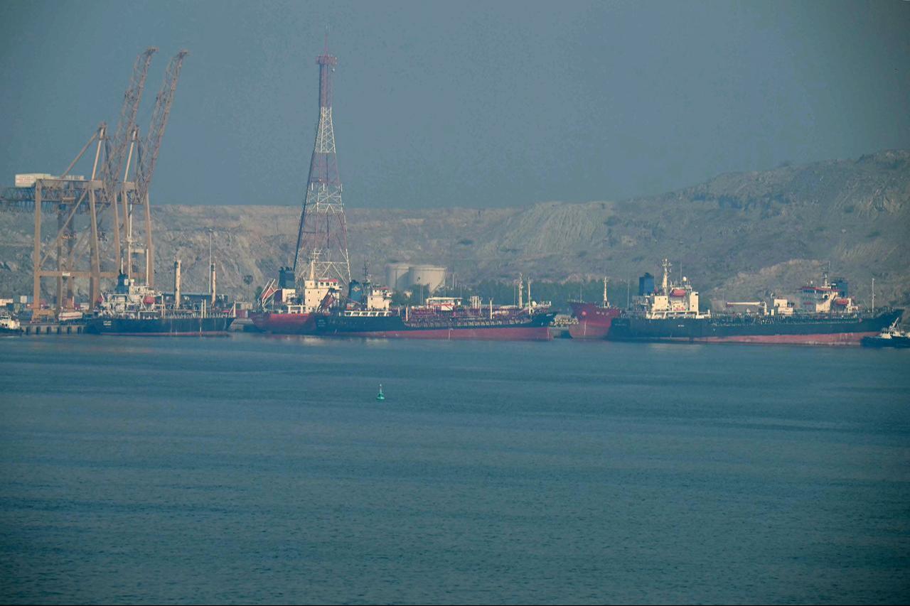 Tankers are seen at the Khor Fakkan Container Terminal, the only natural deep-sea port in the region and one of the major container ports in the Sharjah Emirate, along the Strait of Hormuz on June 23, 2025. (AFP File Photo)