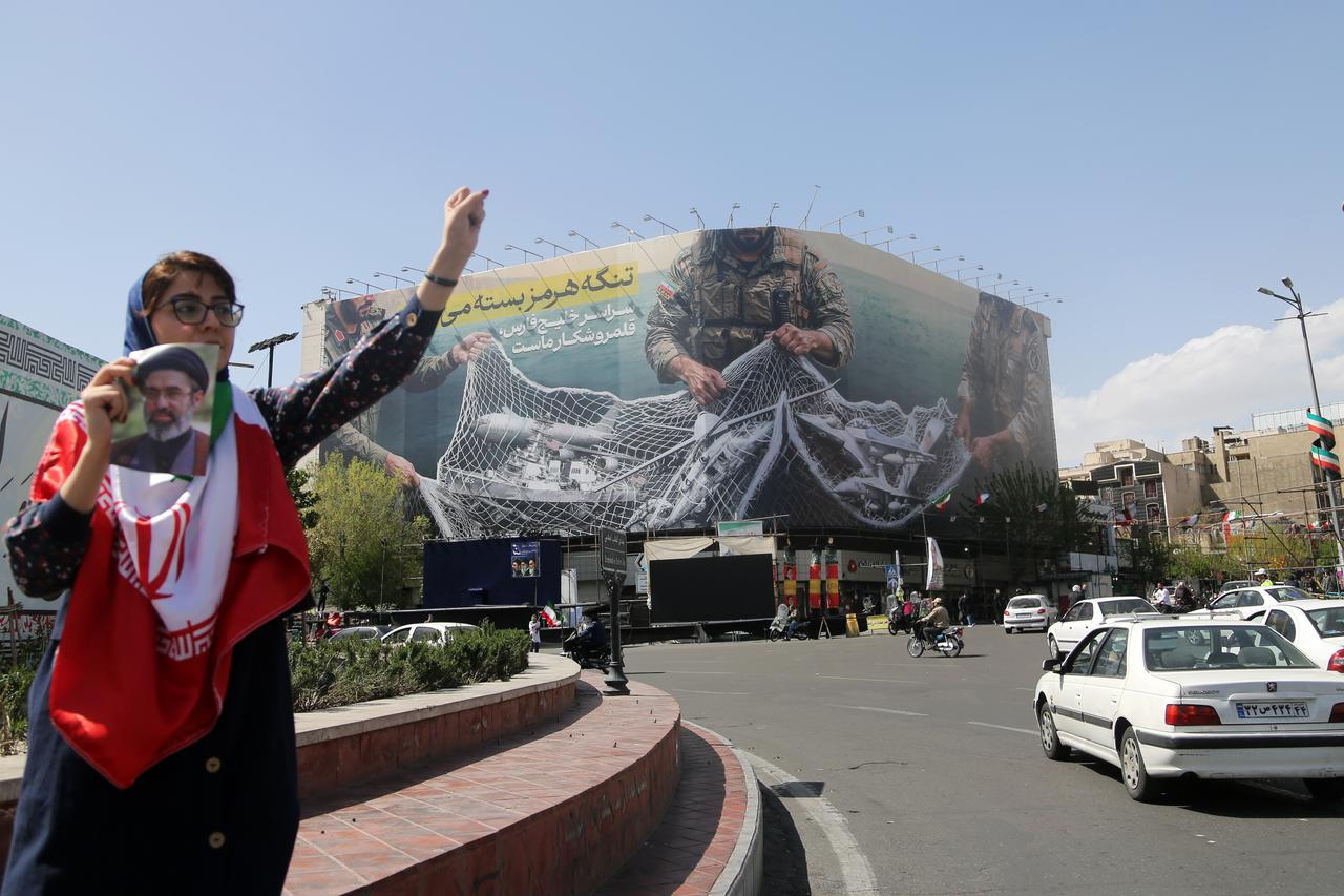 A general view of the giant banner hung Enghelab Square that reads, "The Strait of Hormuz will remain closed; the entire Persian Gulf is our hunting ground." as daily life continues in Tehran, Iran, April 05, 2026. (AA Photo)