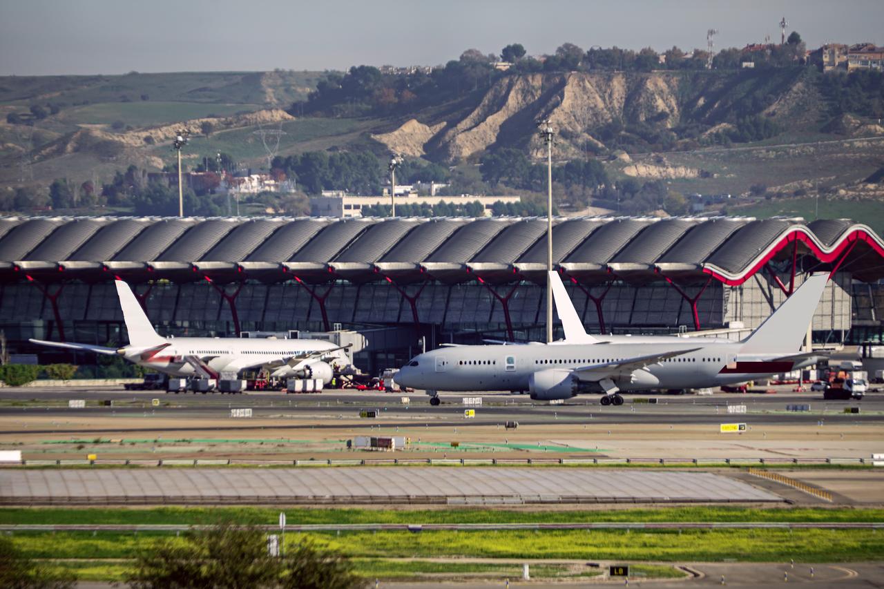 Aircraft taxi near a terminal at Adolfo Suárez Madrid-Barajas Airport in Madrid, Spain. (Adobe Stock Photo)