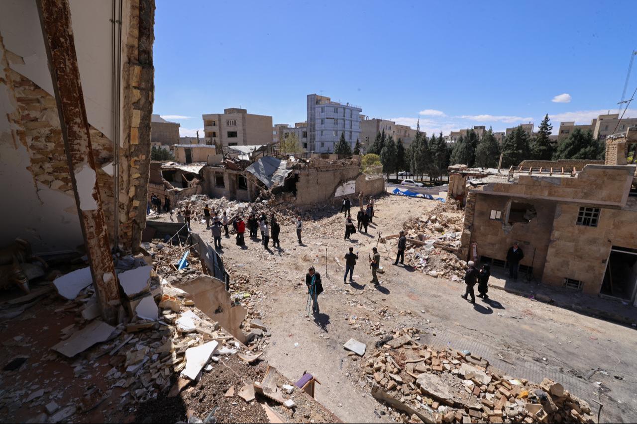Media representatives gather around residential buildings that were damaged by recent strikes at Vahdat town in Karaj, southwest of Tehran, Iran on April 3, 2026. (AFP Photo)
