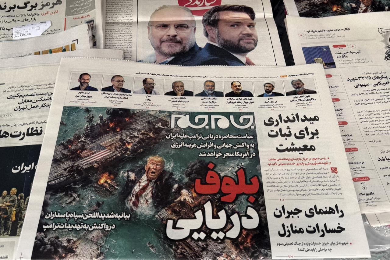 The front page of the Jam Jam newspaper on sale at a newsstand features a cartoon of US President Donald Trump drowning in the Strait of Hormuz with the headline “Marine Bluff” in Tehran, April 13, 2026. (AFP Photo)