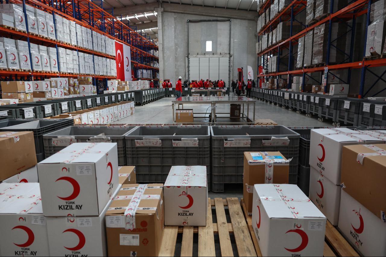Workers handle aid cardboard boxes in Ankara, Türkiye on April 10, 2026 as The Red Cross and Türkiye's Red Crescent plan to send supplies in Iran. (AFP Photo)