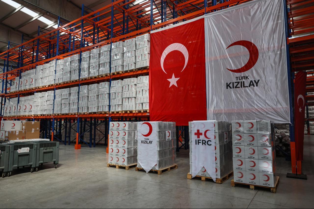 Workers handle aid cardboard boxes in Ankara, Türkiye on April 10, 2026 as The Red Cross and Türkiye's Red Crescent plan to send supplies in Iran. (AFP Photo)