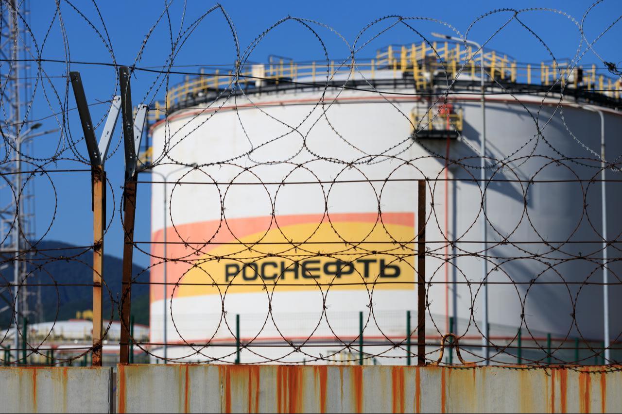 Barbed wire surrounds a Rosneft oil storage facility in Russia. (Adobe Stock Photo)