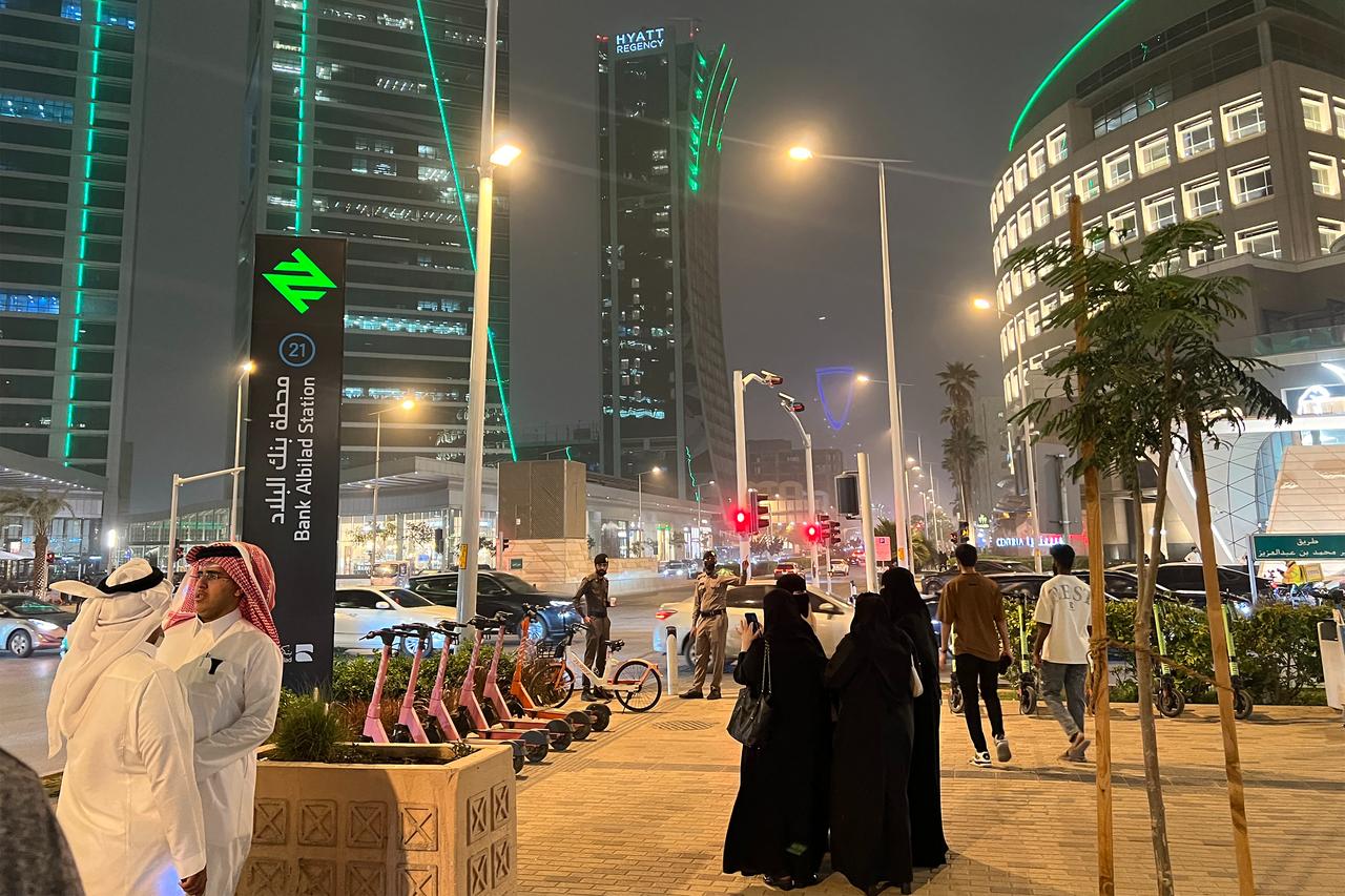 People walk along Riyadh's commercial Tahlia Street late at night on April 4, 2026. (AFP Photo)