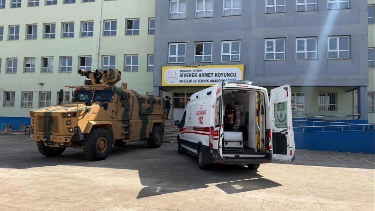 Security officers stand in front of a vocational high school in Sanliurfa’s Siverek district after a person entered the building with a shotgun and opened fire at random on April 14, 2026. (IHA Photo)