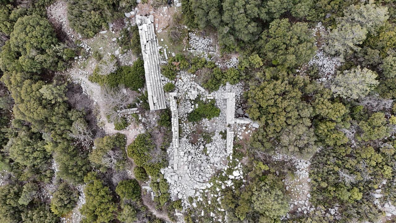 An aerial view shows the forested hills surrounding the ancient city of Adada, where ongoing archaeological excavations reveal a continuous settlement and advanced administrative structure spanning 17 centuries in Sutculer district of Isparta, Türkiye, April 9, 2026. (AA Photo)