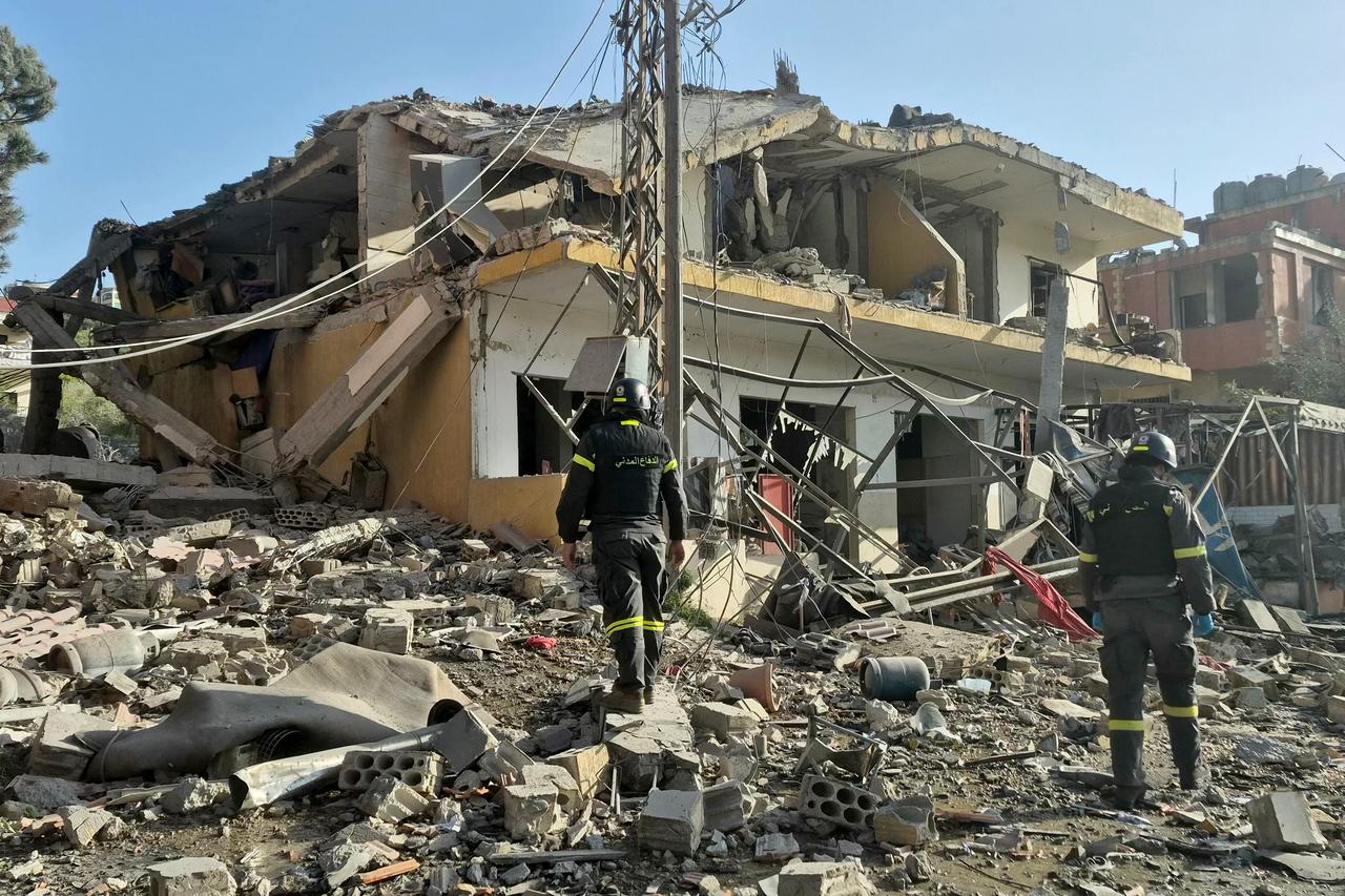 First responders gather at the site of an Israeli airstrike that targeted a neighbourhood in the southern Lebanese village of Kfar Roummane, on April 13, 2026. (AFP Photo)