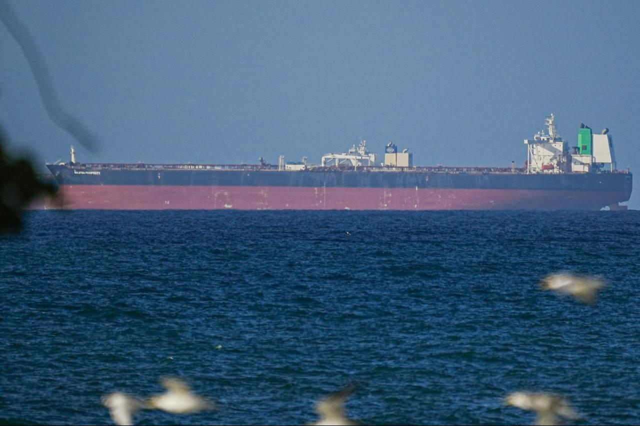 A ship waits to pass through the Strait of Hormuz following the two-week temporary ceasefire between the US and Iran, which is conditional on the opening of the strait, in Oman on April 8, 2026. (AA Photo)