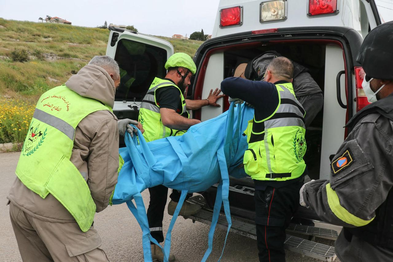 First responders carry a body into an ambulance at the site of an Israeli airstrike in the southern Lebanese village of Abbasiyeh, on the outskirts of Tyre, on April 15, 2026. (AFP Photo)