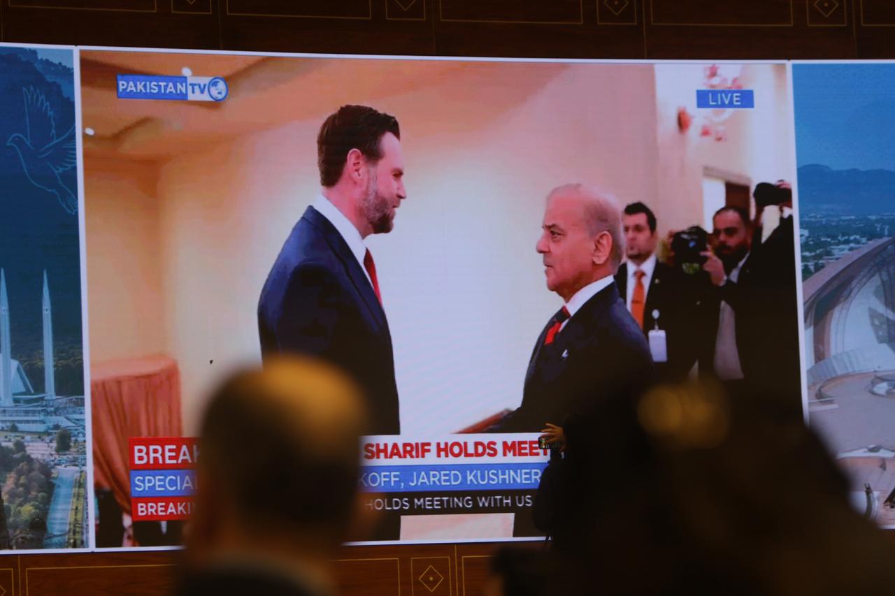 Journalists work as Pakistan's state run television telecasts U.S. Vice President JD Vance meeting with Pakistani Prime Minister Shehbaz Sharif at a media center setup for the coverage of U.S Iran talks in Islamabad, Pakistan, Saturday, April 11, 2026. (AA Photo)