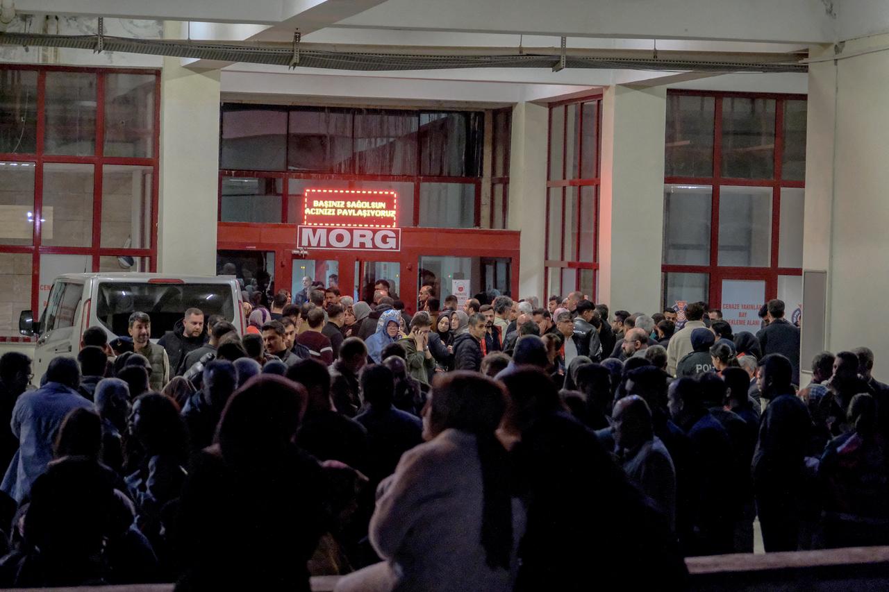 Families of victims wait in front of the morg of a hospital in Kahramanmaras, Türkiye on April 15, 2026, after a 13-year-old teenager opened fire in a school in the city. (AFP Photo)