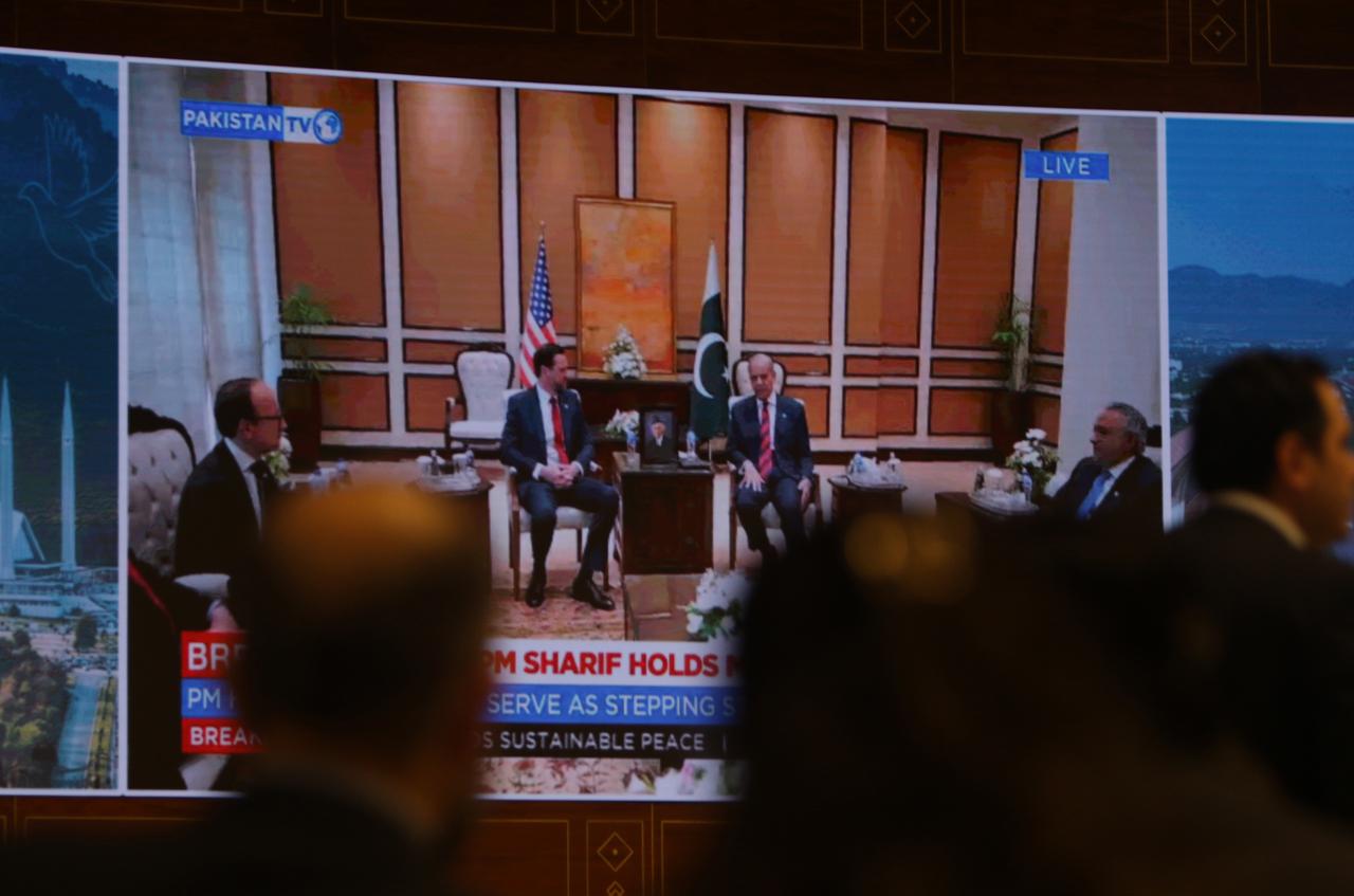 Journalists work as Pakistan's state run television telecasts U.S. Vice President JD Vance meeting with Pakistani Prime Minister Shehbaz Sharif at a media center setup for the coverage of U.S Iran talks in Islamabad, Pakistan, Saturday, April 11, 2026. (AA Photo)