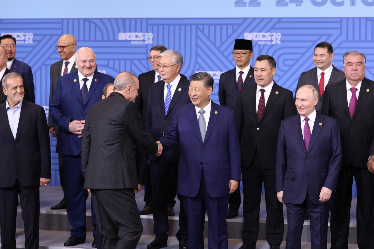 Photo shows Russian President Vladimir Putin (R), Turkish President Recep Tayyip Erdogan (L), and President of China Xi Jinping (C) taking part in the family photo taken at the 16th BRICS Summit in Kazan, Russia on October 24, 2024. (TUR Presidency / AA Photo)