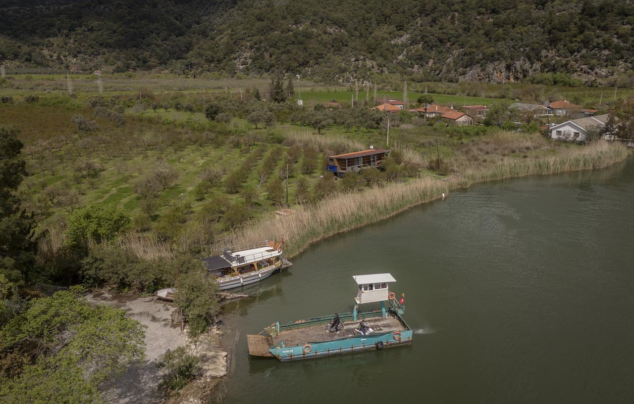 Boats line the waterfront near Dalyan as the ferry route continues to serve both locals and visitors in Mugla, Türkiye. (AA Photo)