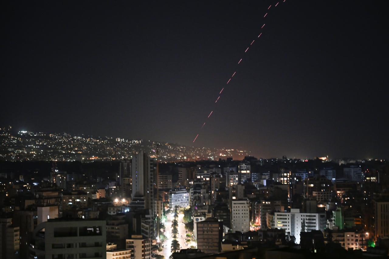 People celebrate in the Dahieh district of southern Beirut on April 17, 2026, following the commencement of a 10-day temporary ceasefire between Israel and Lebanon. (AA Photo)