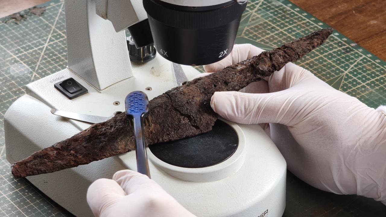 A corroded iron knife is examined under a microscope during laboratory restoration work after being unearthed at Hadrianopolis in Karabuk, Türkiye, April 17, 2026. (AA Photo)