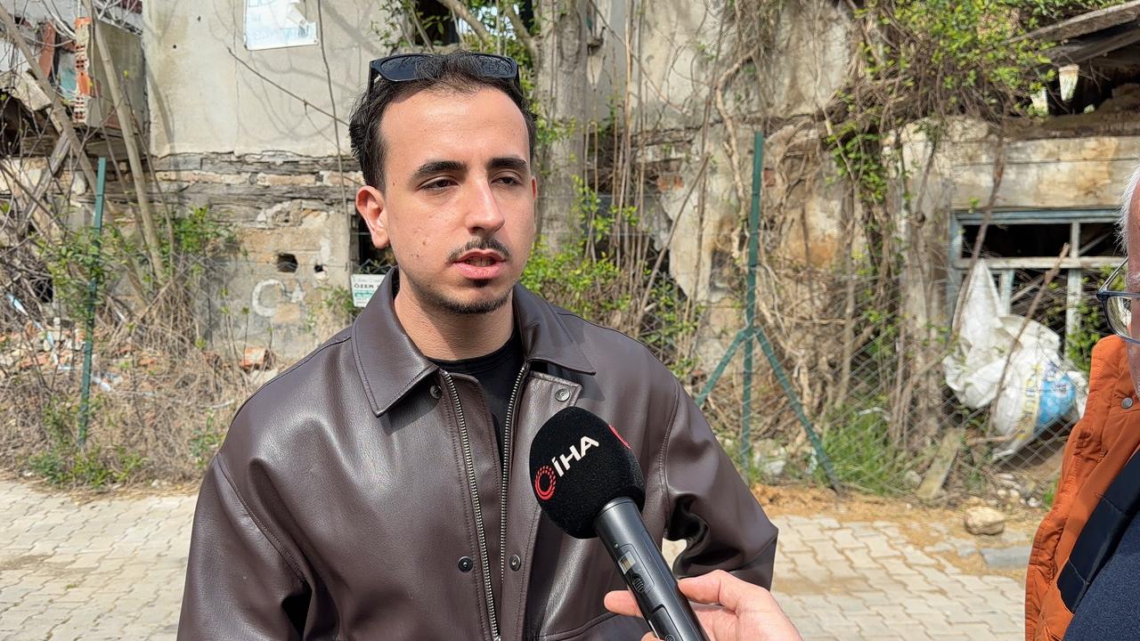 Panagiotis Birmpoutsoukis speaks to media while standing near old houses in Bogazkoy, Arnavutkoy, Istanbul, Türkiye. (IHA Photo)